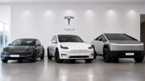 Tesla Model 3, Model Y and Cybertruck parked side by side in a modern minimalist showroom
