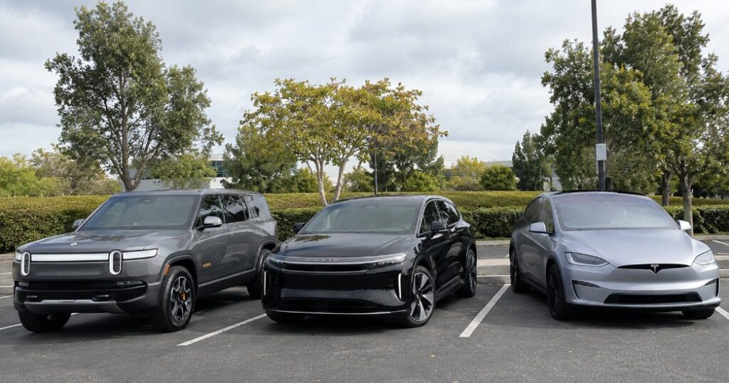 Three electric SUVs parked side by side for a size and design comparison